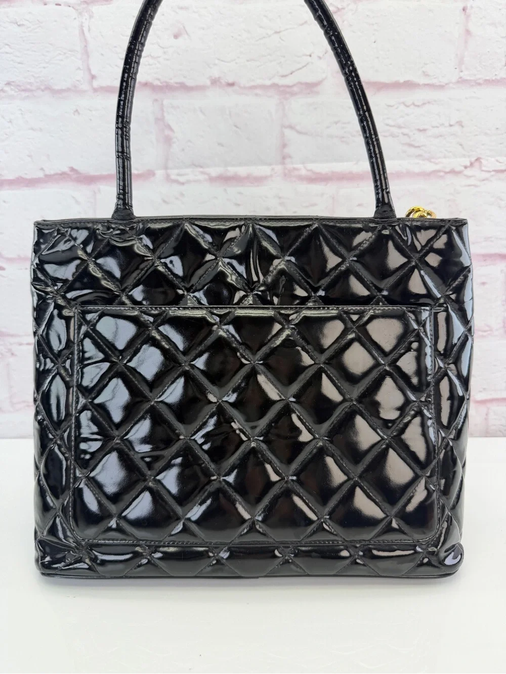 CHANEL Black Quilted Patent Leather Tote with Gold Medallion Charm
